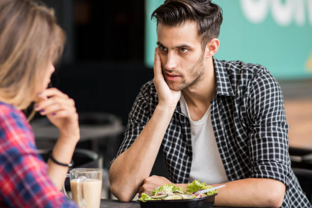 istock Happy loving couple enjoying breakfast in a cafe 1162637775