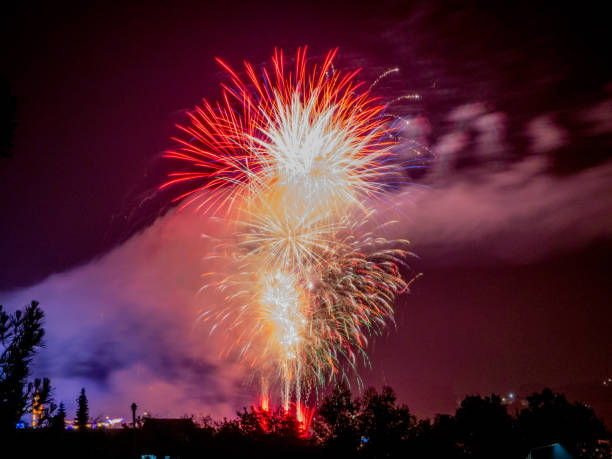 istock colorful fireworks on the black sky background over-water 1162640096