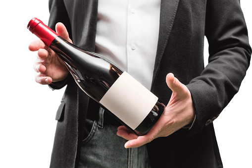 hands with wine bottle. offer. waiter. sommelier