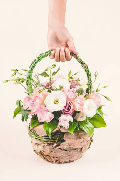 istock Flower bouquet basket and hand. 1162647827