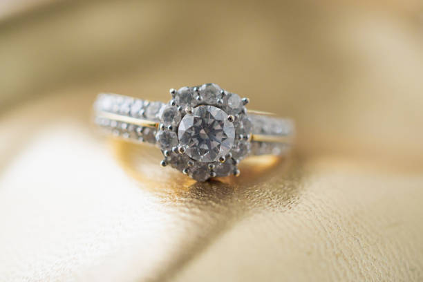 istock luxury jewelry diamond ring on gold background 1162647910