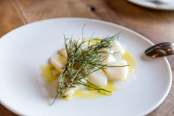 istock scallops with agretti on a plate 1162647919