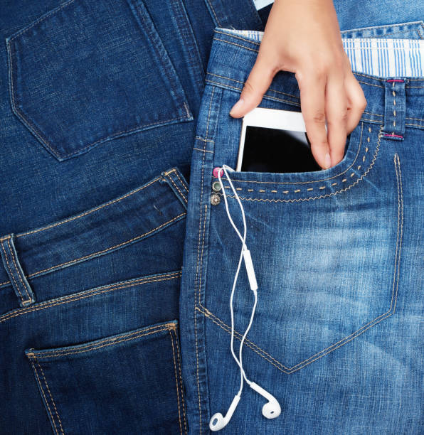istock white smartphone with a blank black screen and headphones 1162648978
