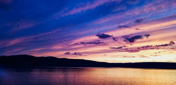 istock Beautiful purple sunset and mountains 1162652571