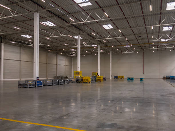istock Interior of empty large modern warehouse garage. 1162652618