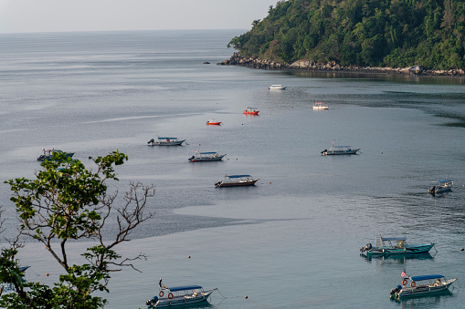 Boats in the waters of the Tioman island.