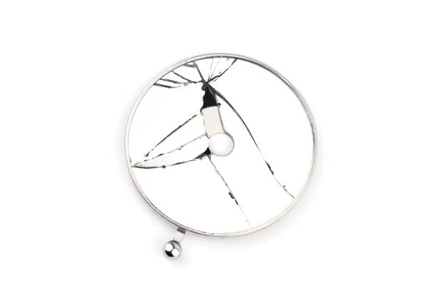 istock Broken round medical mirror isolated on white background 1162663431