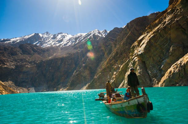GULMIT, PAKISTAN - APRIL 14 : People boating in the Attabad Lake on April 14, 2015 in Gulmit. Attabad Lake transportation by boat start since 2010 after the mountain sliding to obstruct the road.