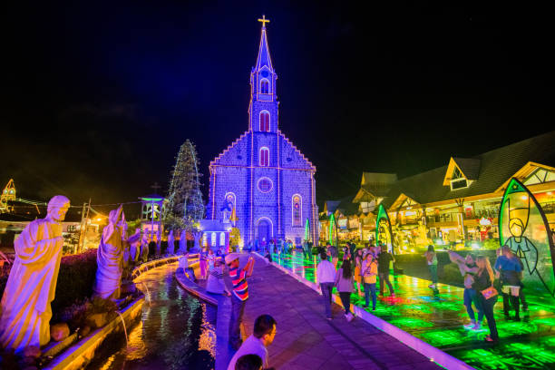 Downtown Gramado and San Peter Church at night. Gramado, Rio Grande do Sul, Brazil - December 28, 2016: Photograph of Gramado with the decoration of Christmas. Image taken three days before the Reveillón. In the image we can see several tourists visiting the city and San Peter Church. gramado stock pictures, royalty-free photos & images