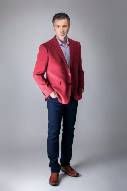 istock Posh Middle Aged Man Wearing Maroon or Red Jacket 1162671873