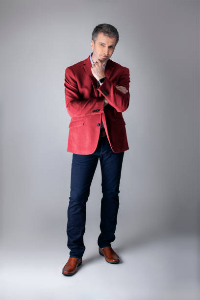 istock Posh Middle Aged Man Wearing Maroon or Red Jacket 1162671889