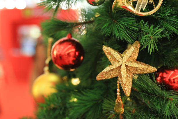 istock Christmas balls and light hanging on pine tree branches. Xmas winter background. 1162675121