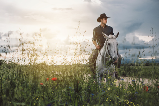 Man out in the wilds, riding a horse