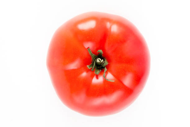 istock One ripe red tomato isolated on white background with shadow 1162680700