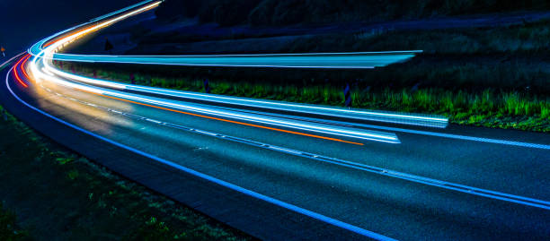 istock lights of cars with night 1162681614