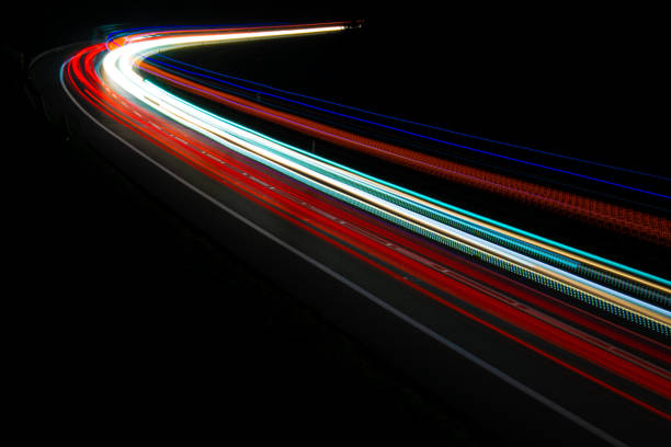 istock lights of cars with night 1162681617