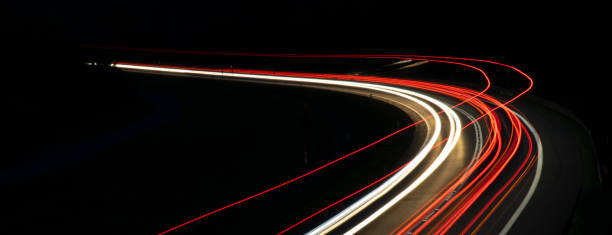 istock lights of cars with night 1162681623