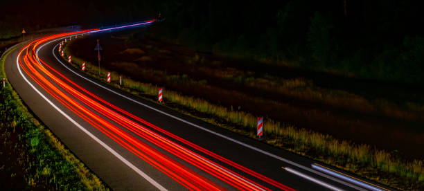 istock lights of cars with night 1162681636