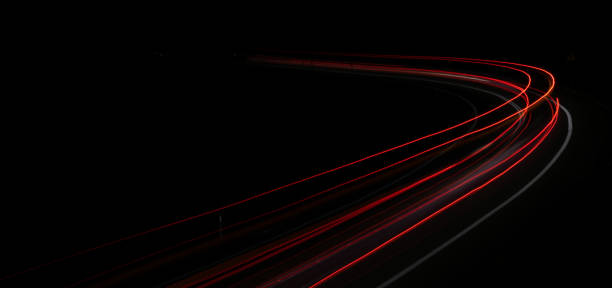 istock lights of cars with night 1162681637