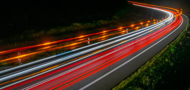 istock lights of cars with night 1162681641