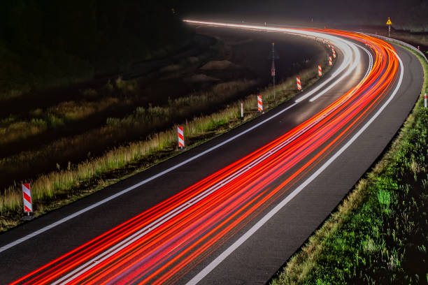 istock lights of cars with night 1162681668