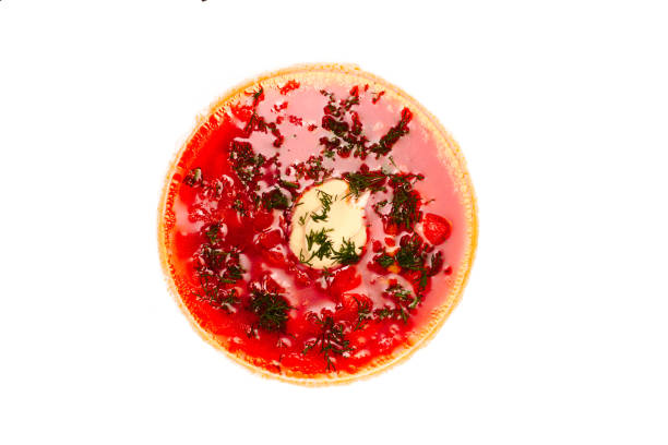 istock Flat top view vegetable beetroot soup, on the table. Isolated borscht in a white plate on white. 1162690954