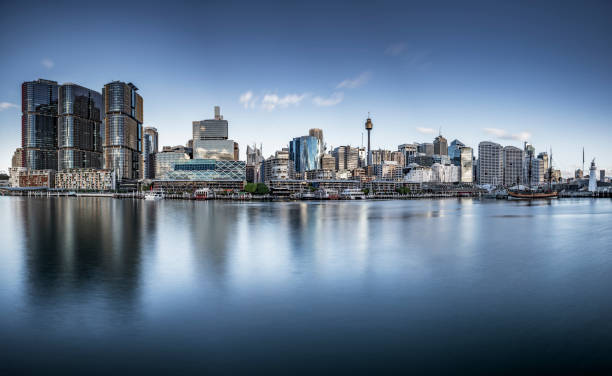 istock Modern Cityscape By River Against Sky 1162692408