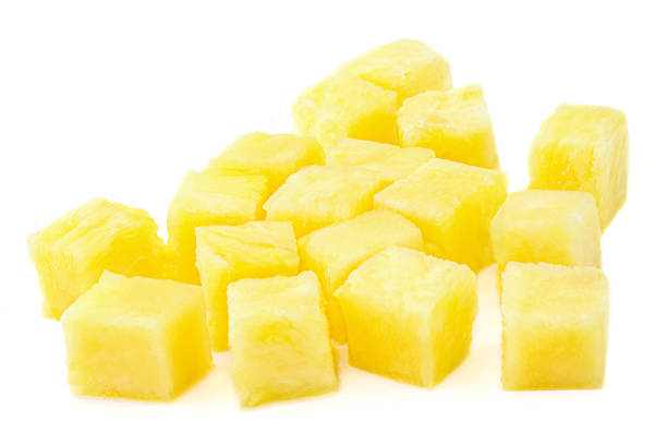 Fresh pineapple cube slices isolated on the white background. Pineapple pieces close up