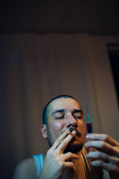 istock Drug Addict Taking a Shot 1162697225