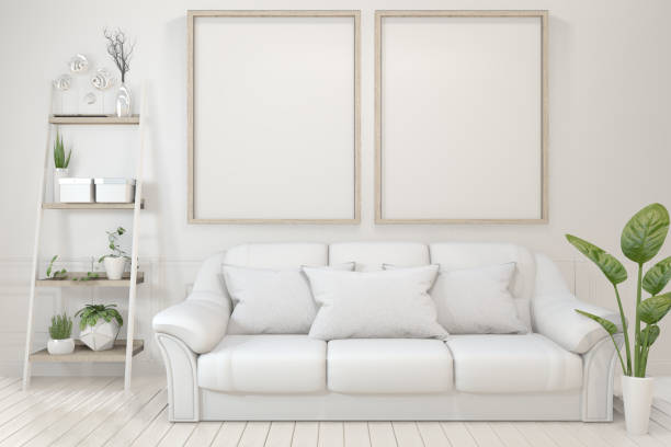 istock Interior poster mock up with  empty wooden frames, sofa, plant and lamp in empty room with white wall. 3D rendering 1162697916