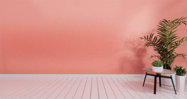 istock mock up in empty interior background, room coral color wall, 3d rendering