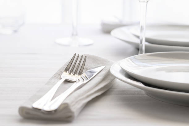 istock Table set with silver cutlery and glassware. Dinning concept background. Close up. 1162698581