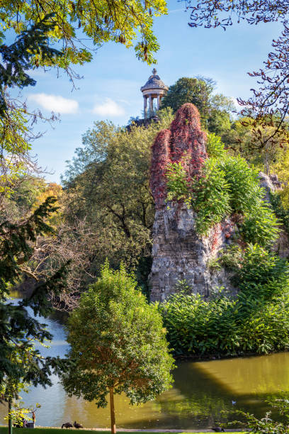 View of rock in Paris park Buttes Chaumont on sunny day.