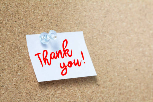 istock Thank you handwriting note on a wooden corkboard 1162700424