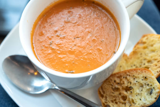 istock POV, Person Looking Down at Soup and Croutons on Lap 1162700878