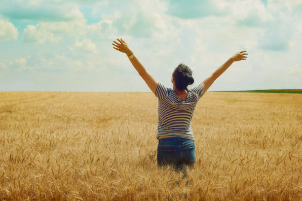 istock woman in a wheat field 1162701731