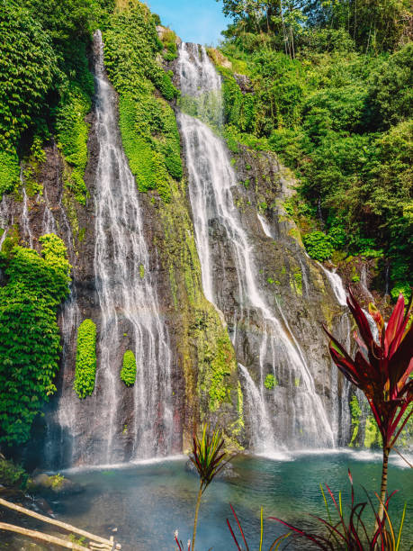 istock Waterfall with crystal water and rainbow in Bali 1162701988