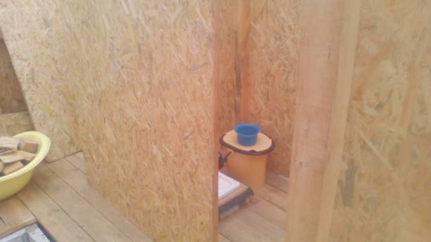 istock Construction of a frame wooden house 1162702355