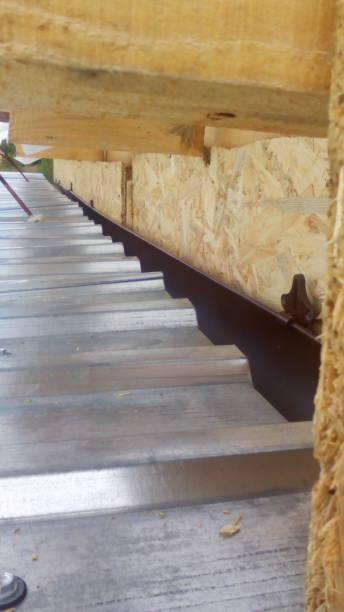 istock Construction of a frame wooden house 1162702378