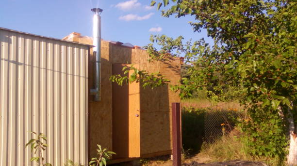 istock Construction of a frame wooden house 1162703146