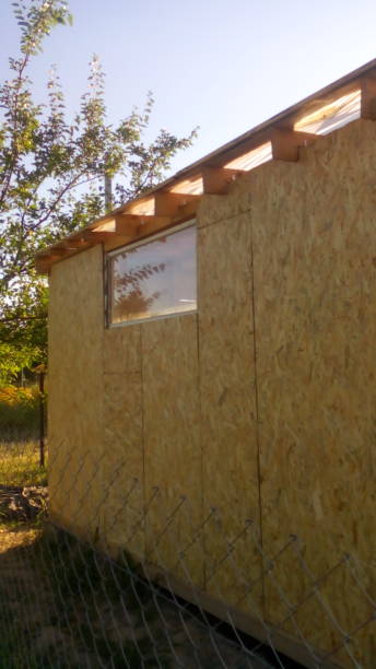 istock Construction of a frame wooden house 1162703150