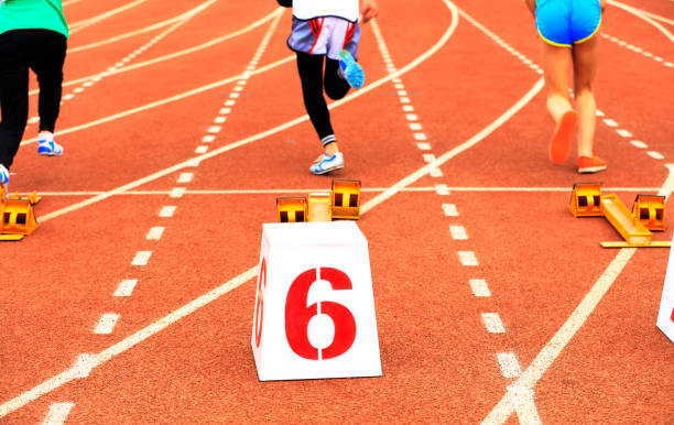 istock sprint start in track and field in blurred motion 1162704672