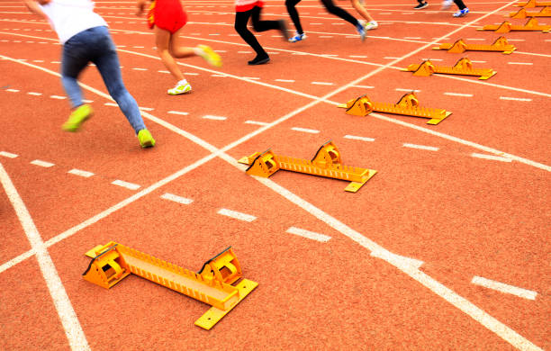 istock sprint start in track and field in blurred motion 1162704756