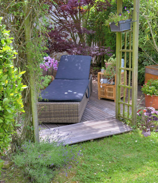 istock sunbathing on a wooden terrace in a garden 1162709728