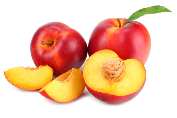 istock Nectarine with green leaf and slices isolated on white background 1162709908