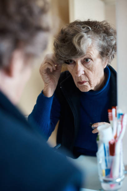istock Never give up! Woman in her 80's applying make-up 1162711025