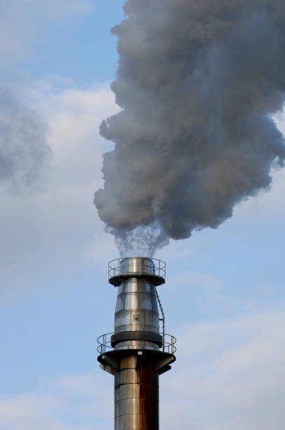 istock smoke and steam from a factory chimney 1162711344