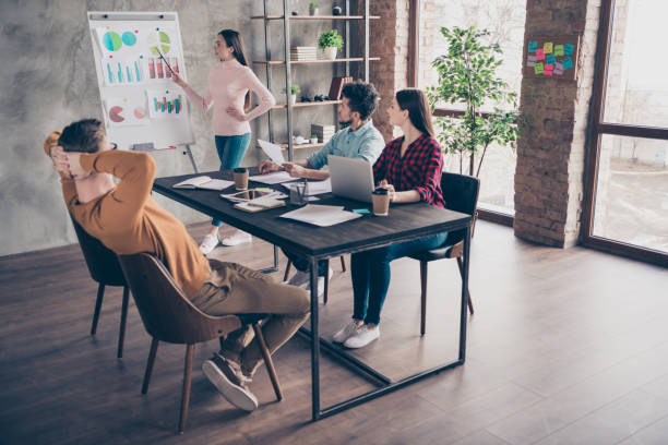 istock Nice attractive clever smart experienced presenter employer showing result progress salary growth corporate classes course coaching table at industrial loft interior workplace workstation 1162711549