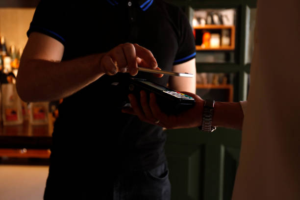 istock Contactless payment using a smart phone hand close up 1162711566