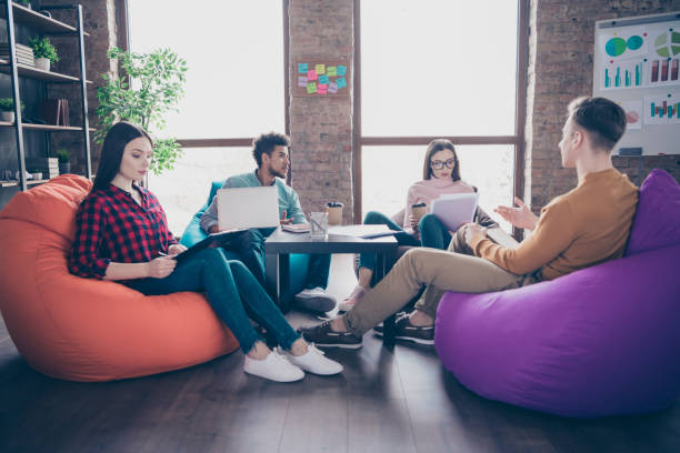 istock Profile side view of nice smart clever busy professional interns preparing financial data marketing development course career staff sitting on bag chair industrial loft interior workplace workstation 1162712236